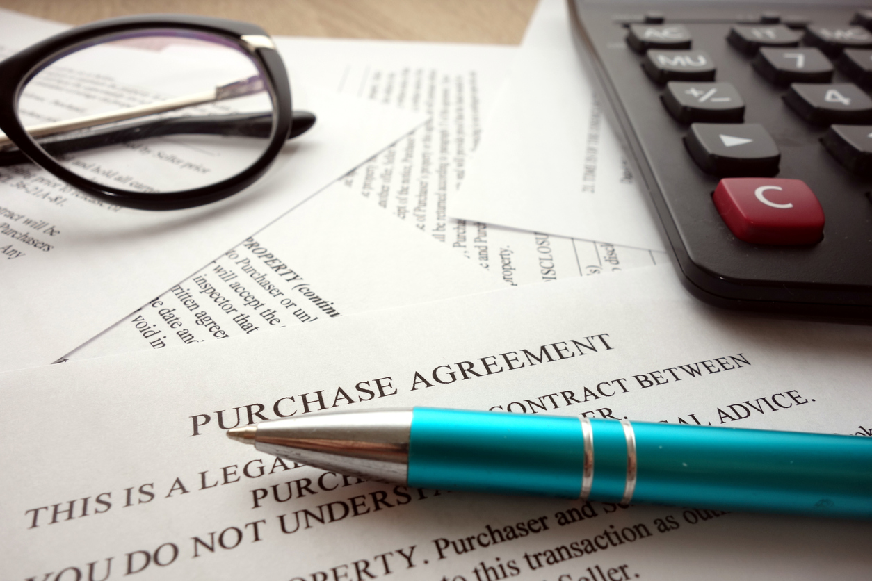 Close up of a Real estate purchase agreement.